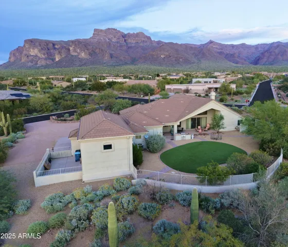 Private desert oasis with expansive mountain, sunset, and city light views. The backyard showcases low-maintenance turf, meticulously designed Sonoran Desert landscaping, and space thoughtfully planned for future outdoor enhancements. Experience true Arizona desert living near hiking trails and the Tonto National Forest.