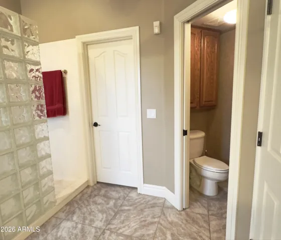 Well-maintained bathrooms ready for personalized updates, and the owner's suite includes a large walk in closet with plenty of storage space