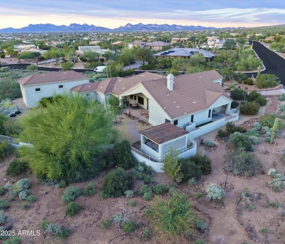 A rare find in Gold Canyon real estate featuring an oversized 3-car garage plus a 40-foot RV garage and RV pad. Ideal for RV owners, outdoor enthusiasts, or buyers needing exceptional storage, all set within the prestigious Superstition Highlands luxury community surrounded by protected desert land.