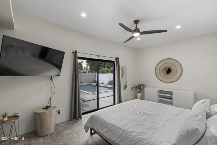 Primary bedroom with slider access to backyard