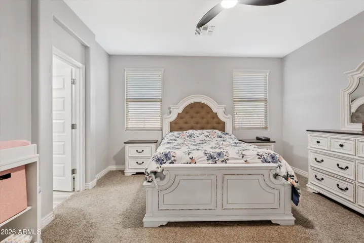 Good sized master suite with ceiling fan and room for growing families