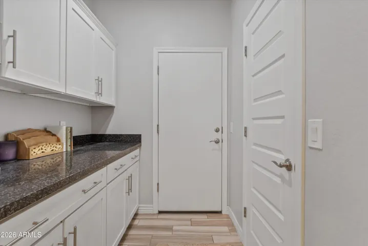 Butler's pantry for additional storage, workspace, and great for buffet style entertaining