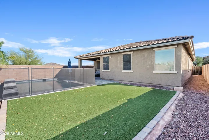 Low maintenance backyard with turf and rock. The kid(s) and pet(s) can roam free!