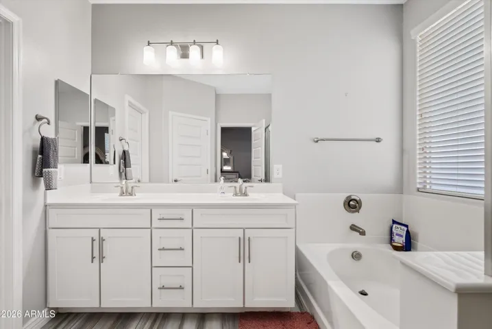 The master bathroom has dual sinks, a separate shower & tub and is a great way to wind down