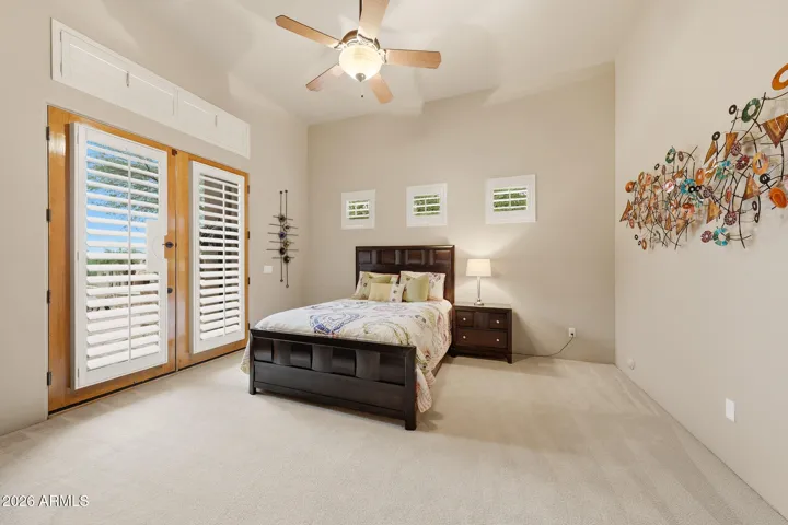 With private exit to backyard oasis
