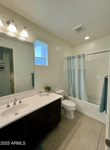 2nd level, hallway bathroom w/ shower/tub combination and single vanity.