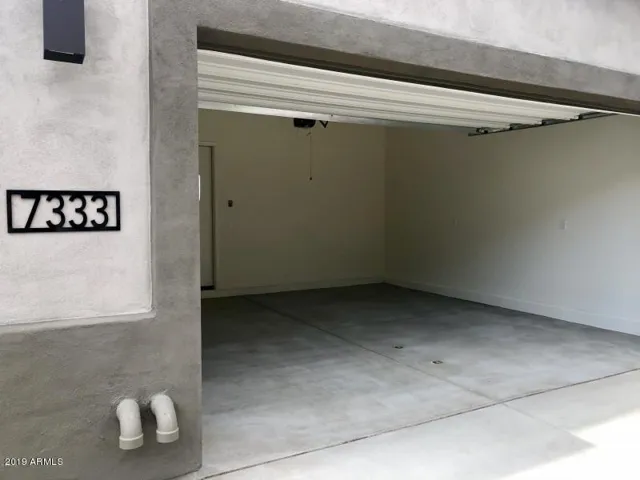 2 car garage opens to the main level with great room, kitchen, casual dining, patio, and powder room.