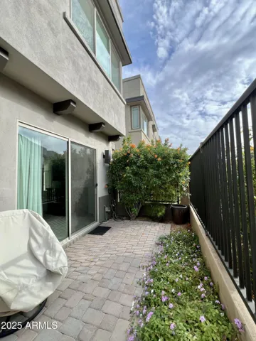 A private patio looks out over green space and makes for a quick walk to the pool, spa, fitness and BBQ areas.