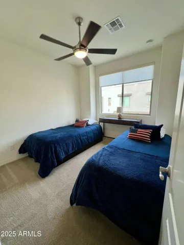 2nd level, (2) twin beds and sliding closet doors.