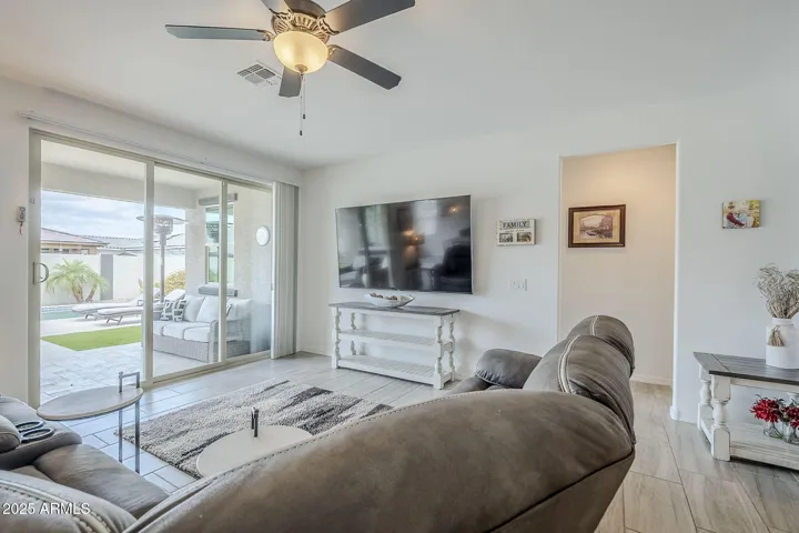 Great room w/ a door to the covered patio area.