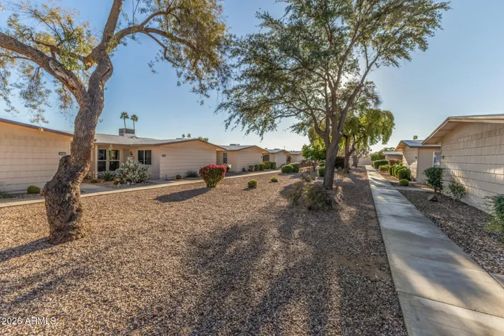 Entry courtyard area, large guest parking to the West