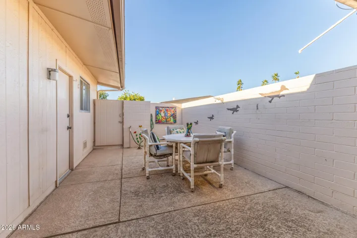 Looking North from the AZ room. Thisre is a security gate and privacy door leading to alleyway.