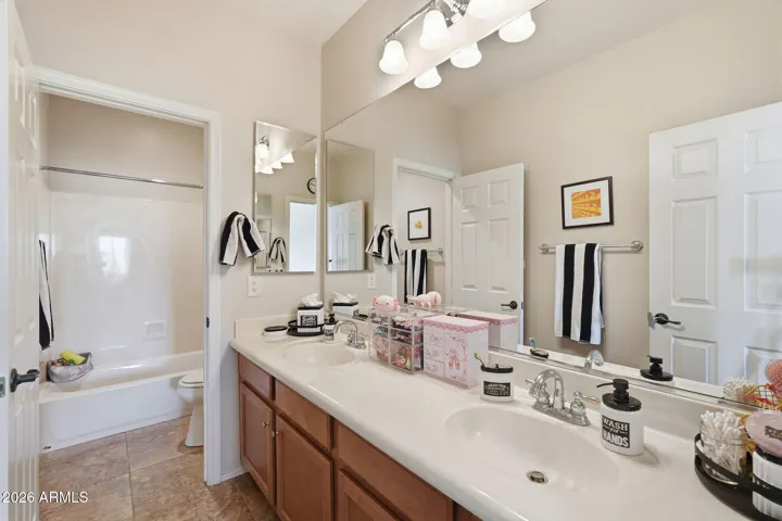 Double sinks and separate bath/shower/toilet room.