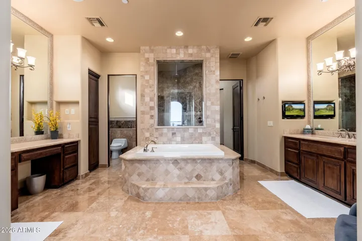 LARGE PRIMARY BATH WITH SOAKING TUB AND SUAL VANITIES