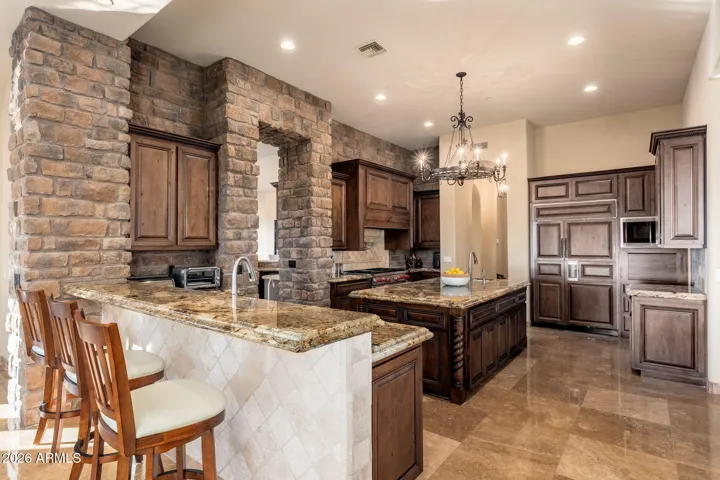 BREAKFAST BAR OPEN TO FAMILY ROOM AND NOOK