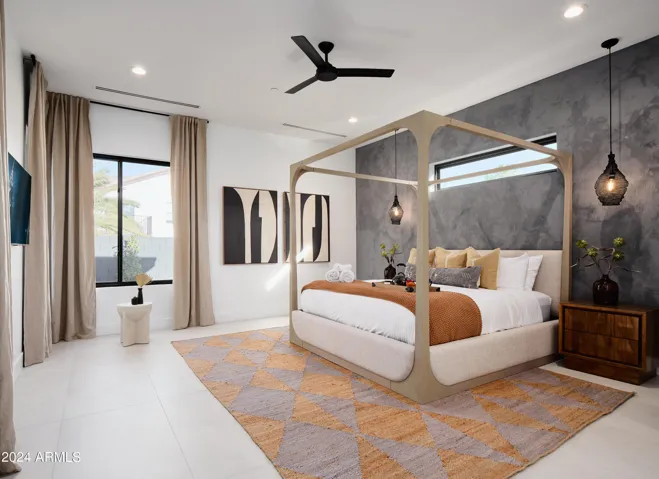 Primary Bedroom featuring a King bed with backyard access, a Smart TV and an en-suite Primary bathroom.
