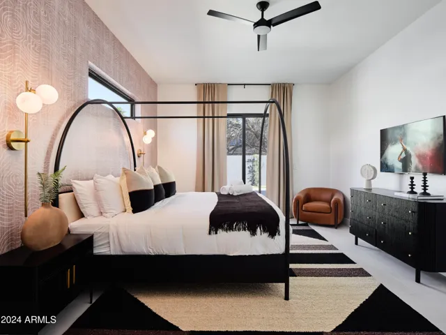 2nd Bedroom featuring a King bed, a Smart TV, closet space, and an en-suite bathroom.