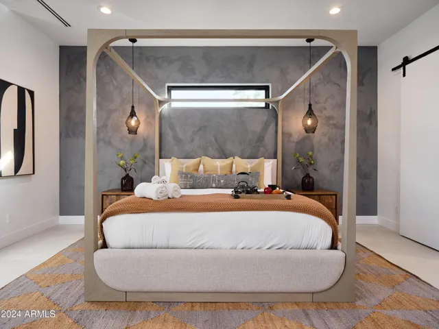 Primary Bedroom featuring a King bed with backyard access, a Smart TV and an en-suite Primary bathroom.