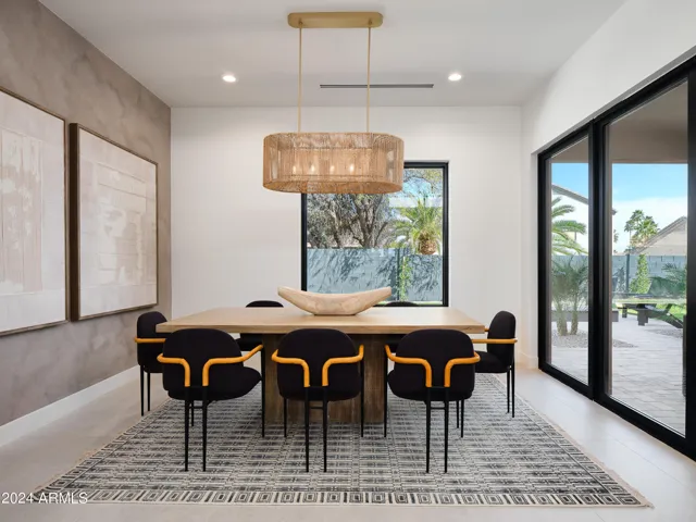 Formal dining area set for 8 guests.