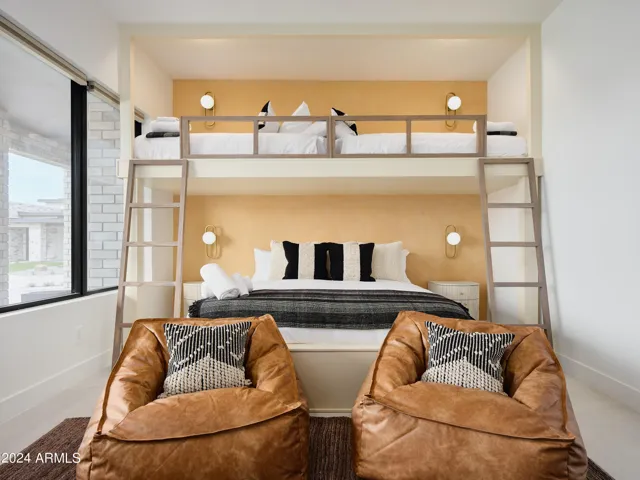 5th Bedroom featuring 2 Twin beds over a King bed with a Smart TV, closet space, and bedroom furnishings.