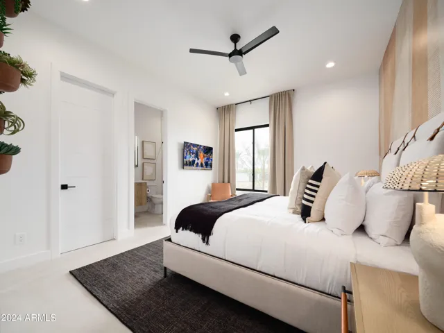 4th Bedroom featuring a King Bed with a Smart TV, closet space, and an en-suite bathroom.