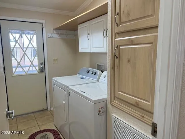 Laundry room and door to side patio