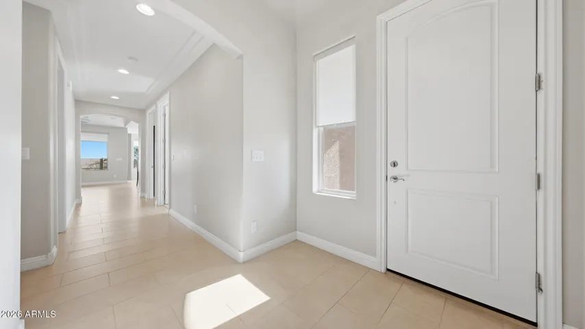 Windows across the entire back of the home provide a light filled, delightful space to walk toward