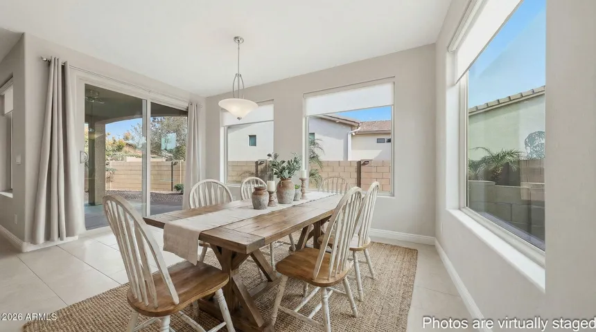 Large dining room with surrounding windows that make the area feel even larger!