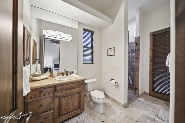 Guest Suite with Generous Walk-In Closet and Private Bath also Used as a Pool Bath