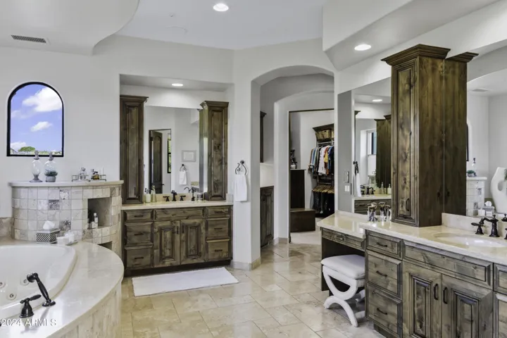 Spa-Like Bathroom with Dual Vanities & Make Up Station