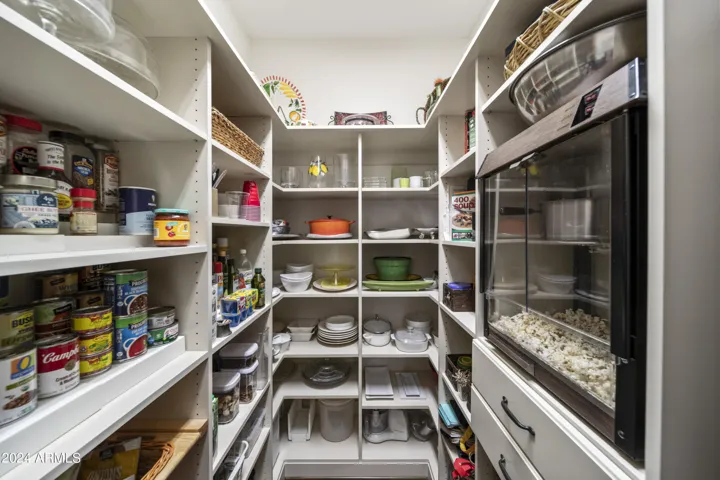 Spacious Walk-In Pantry with Built-In Popcorn Machine