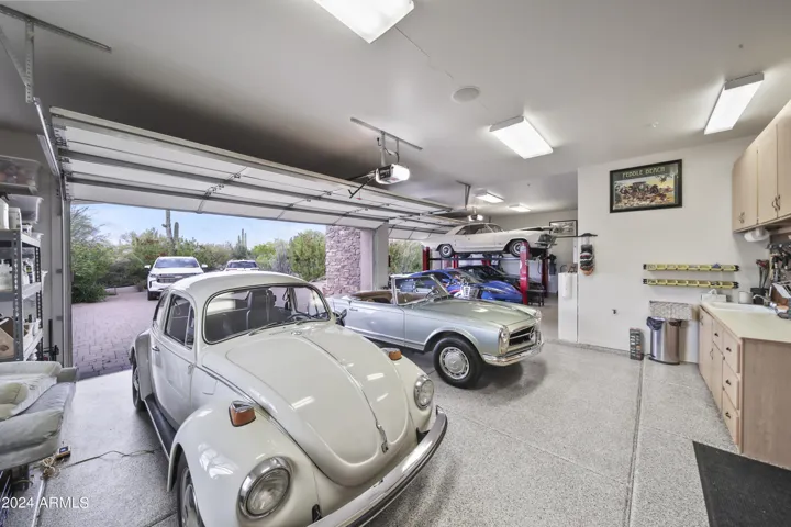Amazing 4 plus Garage with Lifts, Built-In Workbench & Sink. Plenty of Custom Storage Cabinets
