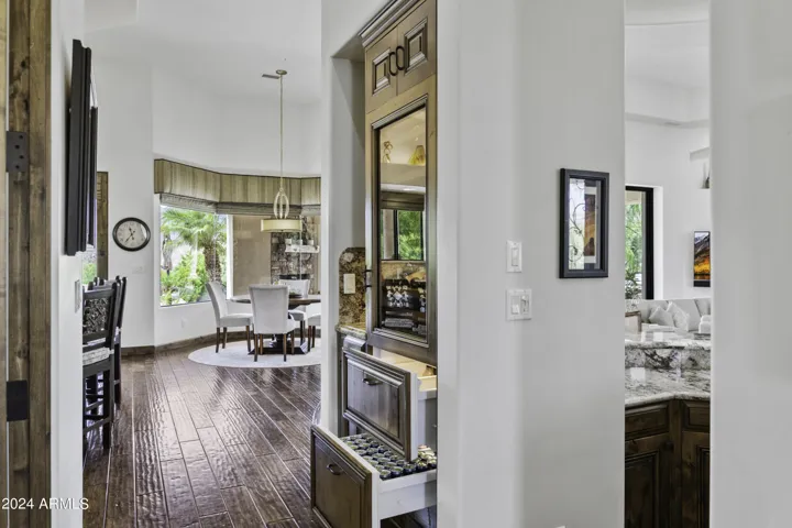 Chic Beverage Center with Glass-Front Cabinets and Beverage Drawers
