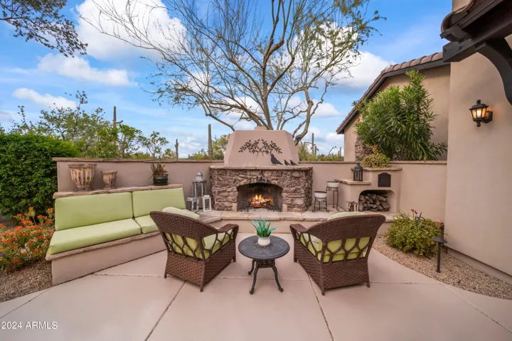 Romantic Evenings by the Wood Burning Courtyard Fireplace
