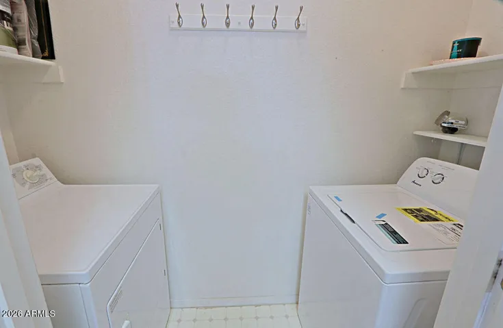 Full SizeWasher and Dryer in room off Kitchen.