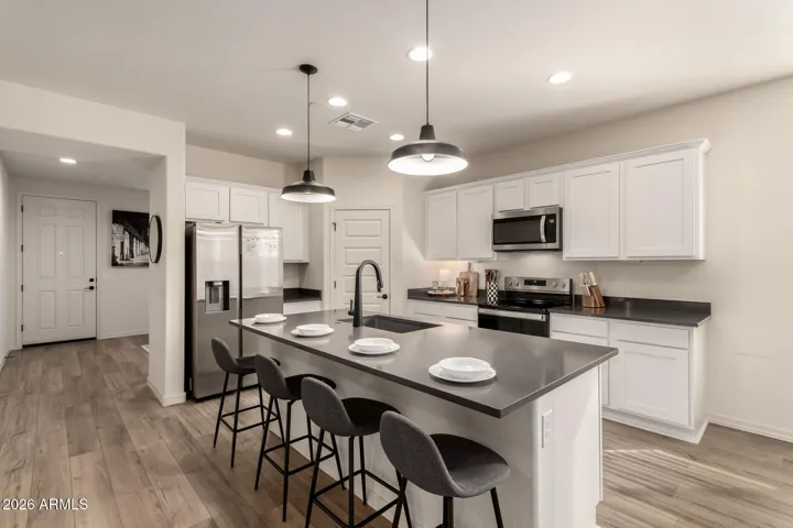 Expansive breakfast bar, perfect for morning coffee or casual dinner.
