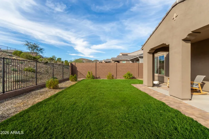 Beautiful backyard with views of hillside and white peak mountain.