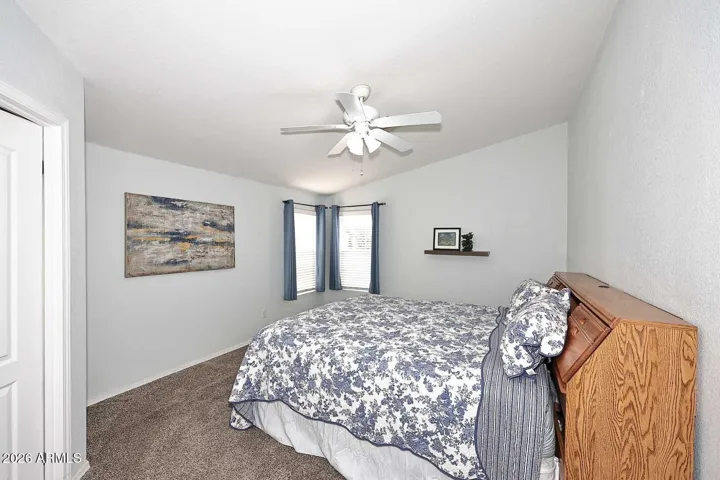 Master bedroom with a walk in closet