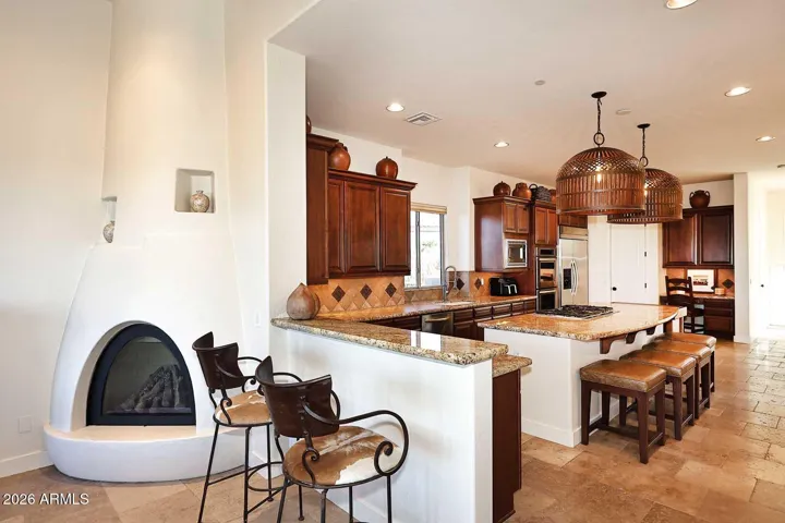 Gas fireplace in family room adjacent to kitchen