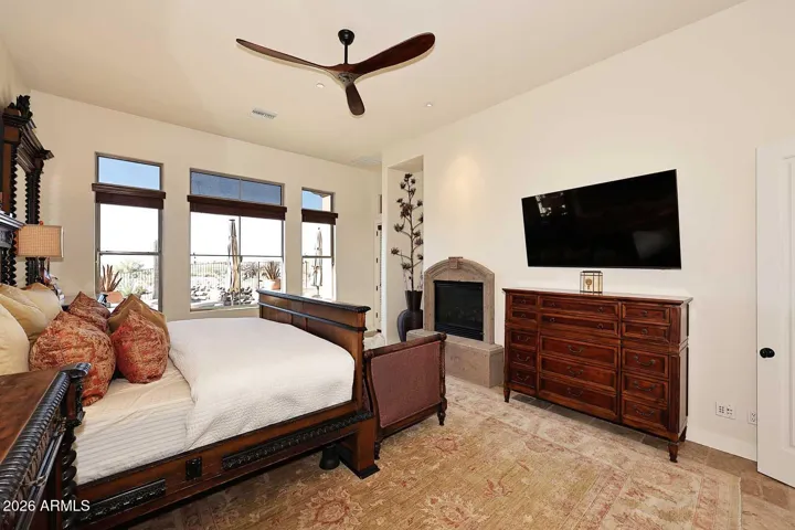 Primary Bedroom features door to backyard