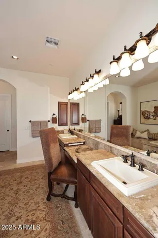 Primary bath has honed travertine flooring