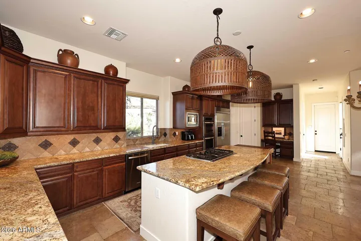 Kitchen features granite countertops