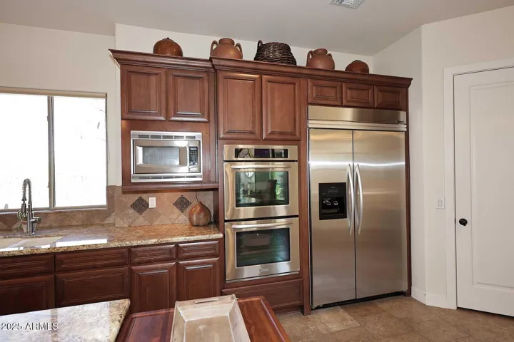 Chef's kitchen features double ovens