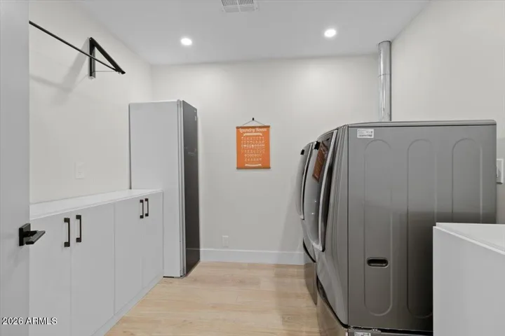 Main floor laundry plumbed for a sink. Steam Cabinet included