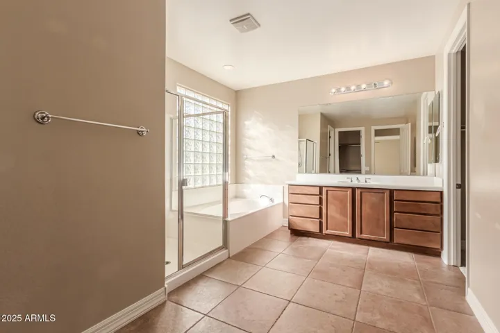 Huge main bathroom with dual walk-in closets