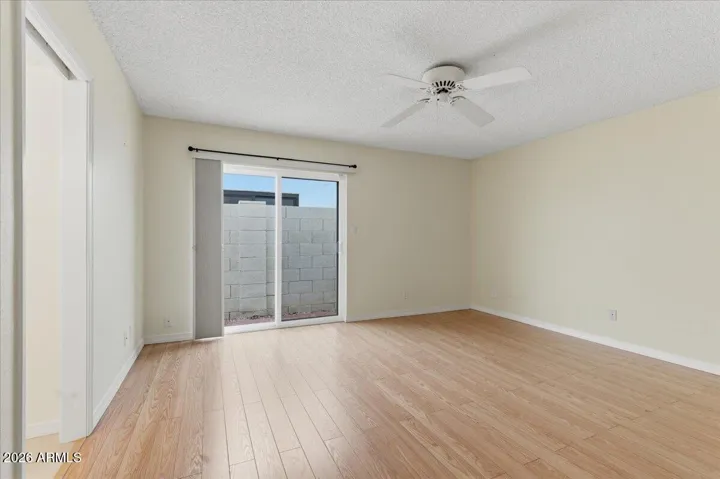 Sliding door to private yard from the primary suite.