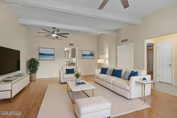 Virtually Staged Family Room that has plenty of room for a formal dining space as well.