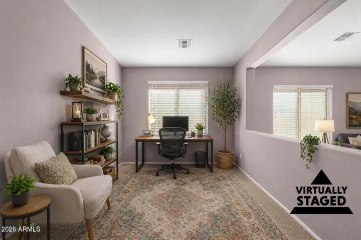 This living space has been virtually staged as an office to show the potential use for this great space!