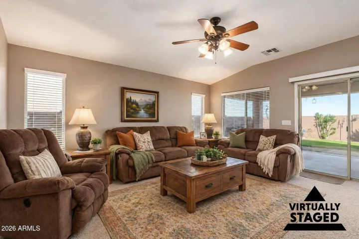 The living room has been virtually staged to add a few other cozy touches.