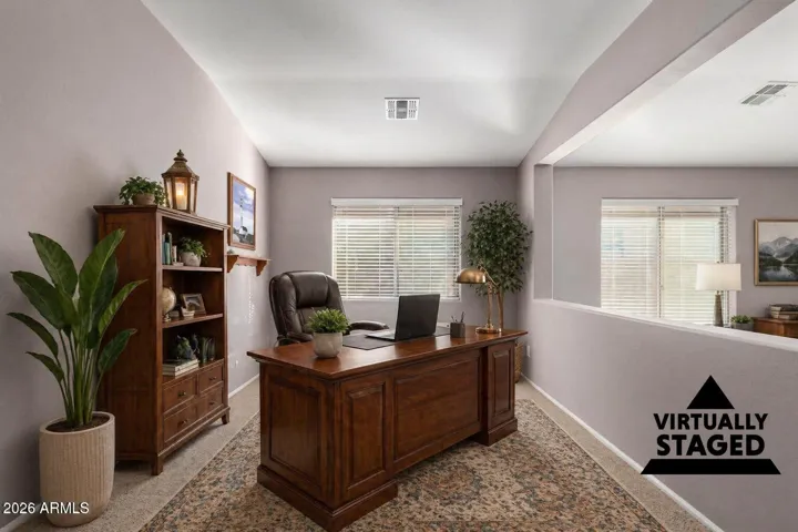 Here is a second virtual staging of this space to show another office configuration of the den.
